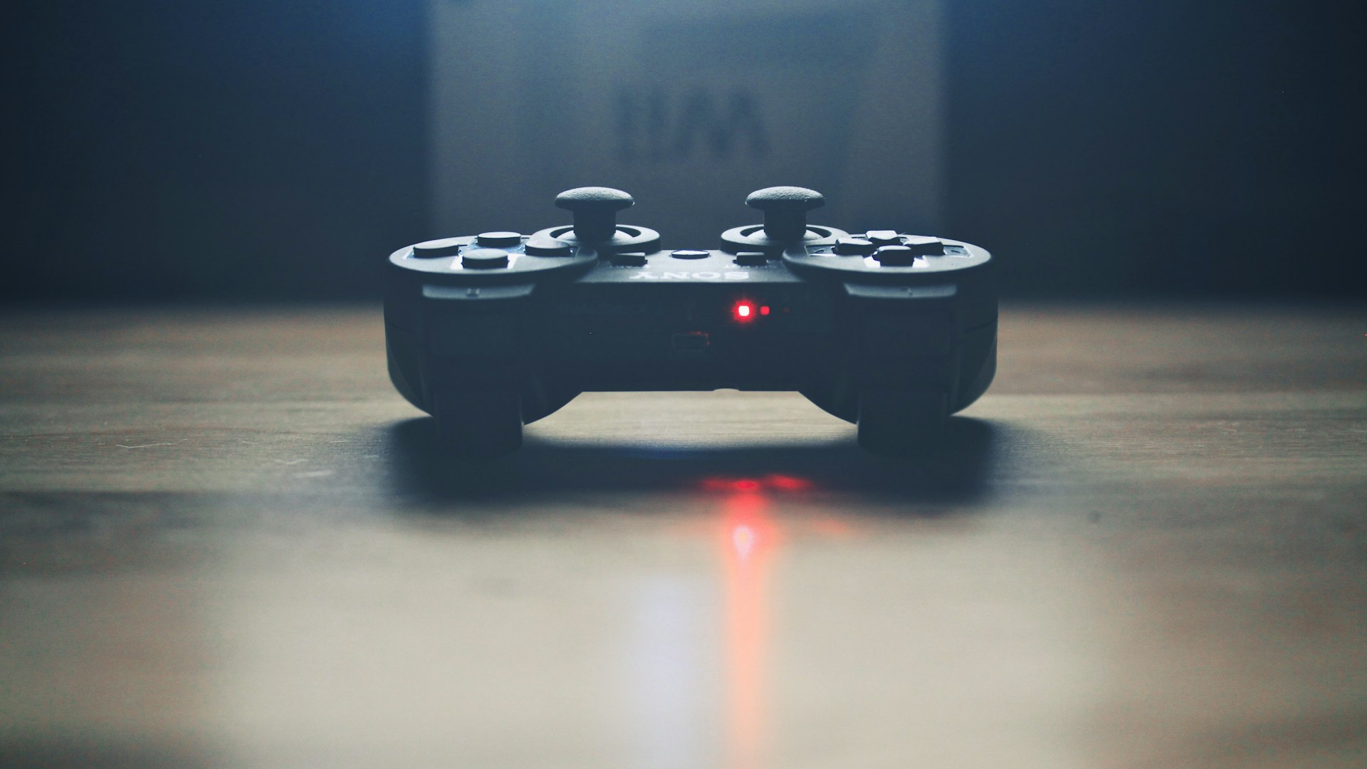 Neon-lit gaming setup glowing in a dark room